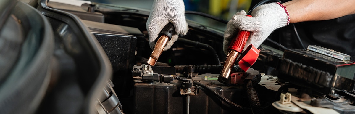 Car battery connected to terminals