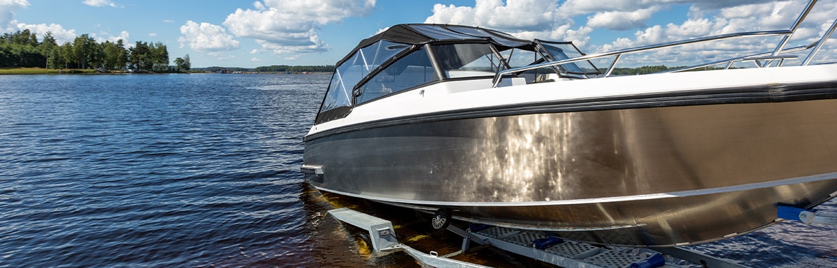 Boat being launched from a trailer at a boat ramp