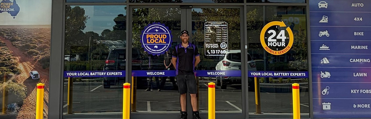 Sean standing in front of the Battery World Ellenbrook store